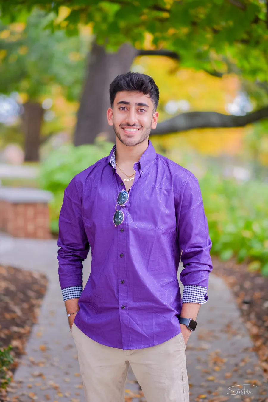Chiraag Nadig smiling outdoors in a purple shirt